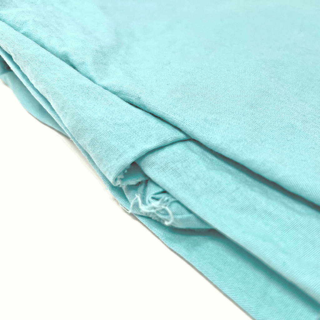 Simple, joyeux, ce tissu turquoise offrira de l’absorption pour les premières journées ensoleillées