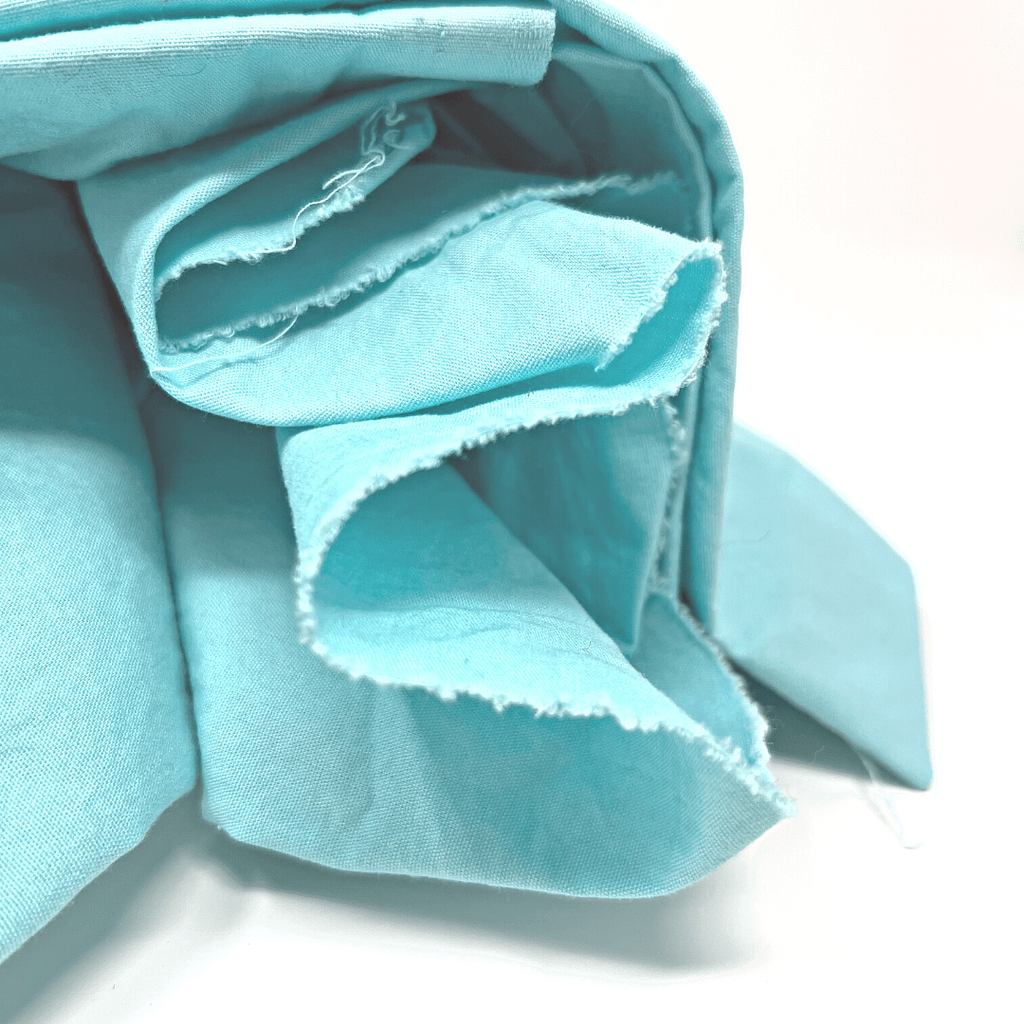 Simple, cheerful, this turquoise fabric will offer absorbency for the first sunny days