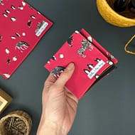 small pink handkerchief with penguins and zebras