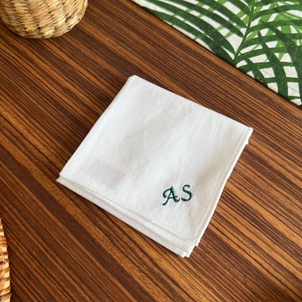 white handkerchief with embroidered initials