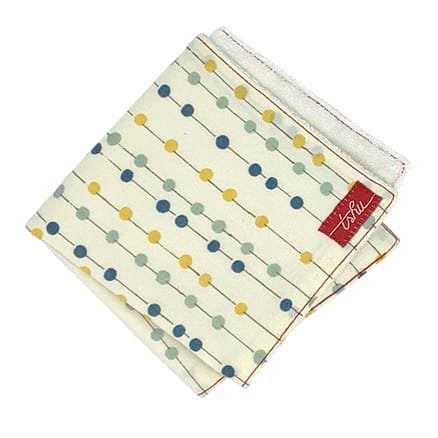 ivory bamboo washcloth with yellow and blue dots